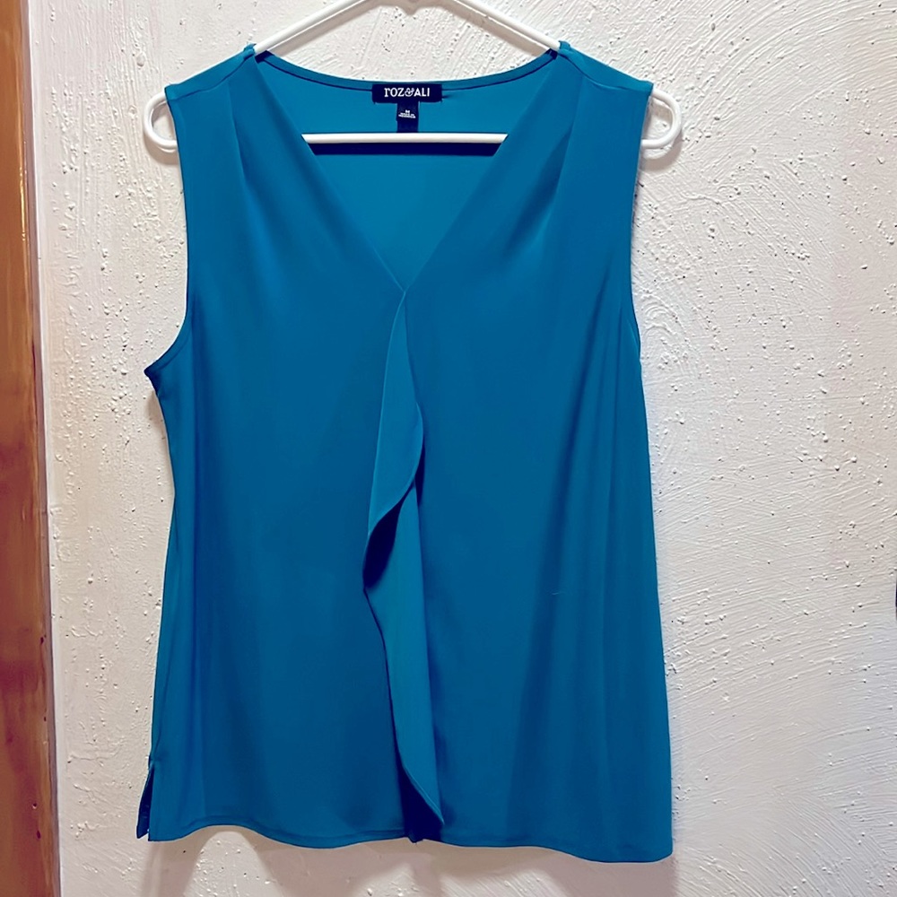 Super soft/silky turquoise shirt.